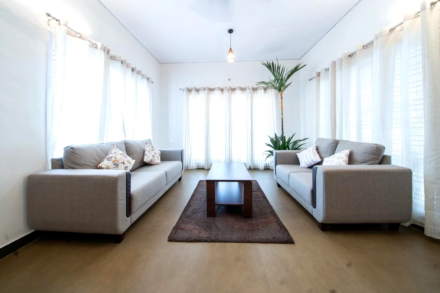 Main living room at Mango Tree Homestay with family seating.